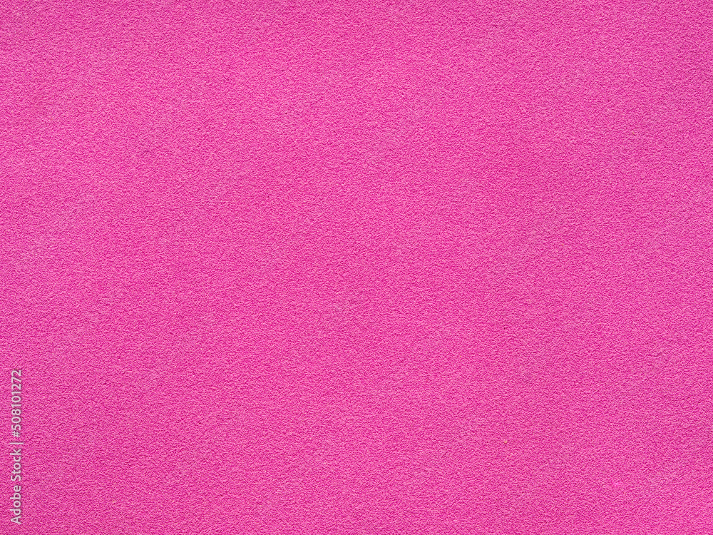 The texture of the pink sponge surface is a seamless background. Bright pink textured surface as a background. Crimson texture pattern of abstract background. pink background The texture of the pink sponge surface is a seamless background. Bright pink textured surface as a background. Crimson texture pattern of abstract background. pink background