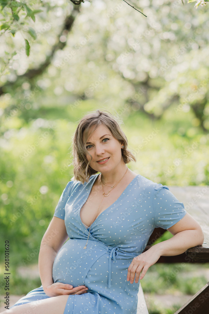 Middle-aged beautiful pregnant woman dreaming about child outdoors. Happy expectant thinking about baby and enjoying her future life. Motherhood, pregnancy, happiness, health care concept, copy space. Middle-aged beautiful pregnant woman dreaming about child outdoors. Happy expectant thinking about baby and enjoying her future life. Motherhood, pregnancy, happiness, health care concept, copy space.
