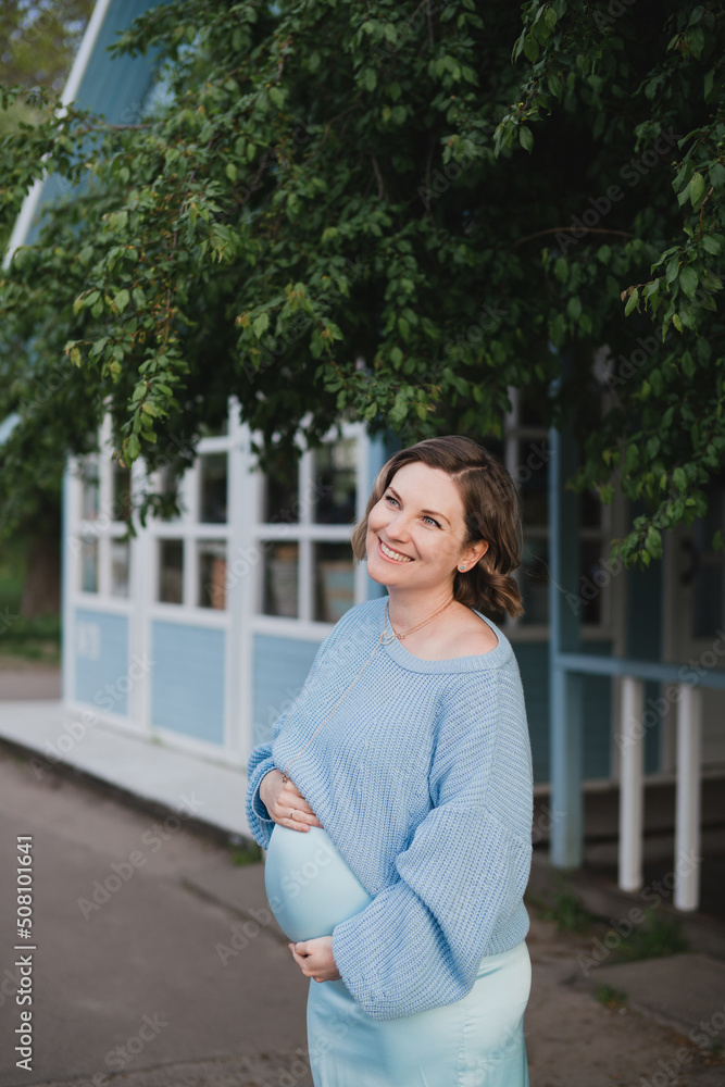 Middle-aged beautiful pregnant woman dreaming about child outdoors. Happy expectant thinking about baby and enjoying her future life. Motherhood, pregnancy, happiness, health care concept, copy space. Middle-aged beautiful pregnant woman dreaming about child outdoors. Happy expectant thinking about baby and enjoying her future life. Motherhood, pregnancy, happiness, health care concept, copy space.