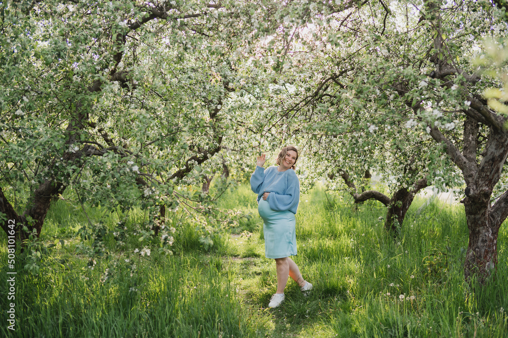 Middle-aged beautiful pregnant woman dreaming about child outdoors. Happy expectant thinking about baby and enjoying her future life. Motherhood, pregnancy, happiness, health care concept, copy space. Middle-aged beautiful pregnant woman dreaming about child outdoors. Happy expectant thinking about baby and enjoying her future life. Motherhood, pregnancy, happiness, health care concept, copy space.
