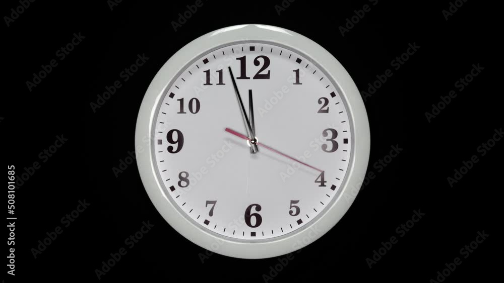 White Wall Clock With A Black Arrows And Red Second Hand On Black Background. Wall Clock Face Of Time Of 12.00 Am Or Pm. 4k. ProRes. White Wall Clock With A Black Arrows And Red Second Hand On Black Background. Wall Clock Face Of Time Of 12.00 Am Or Pm. 4k. ProRes.
