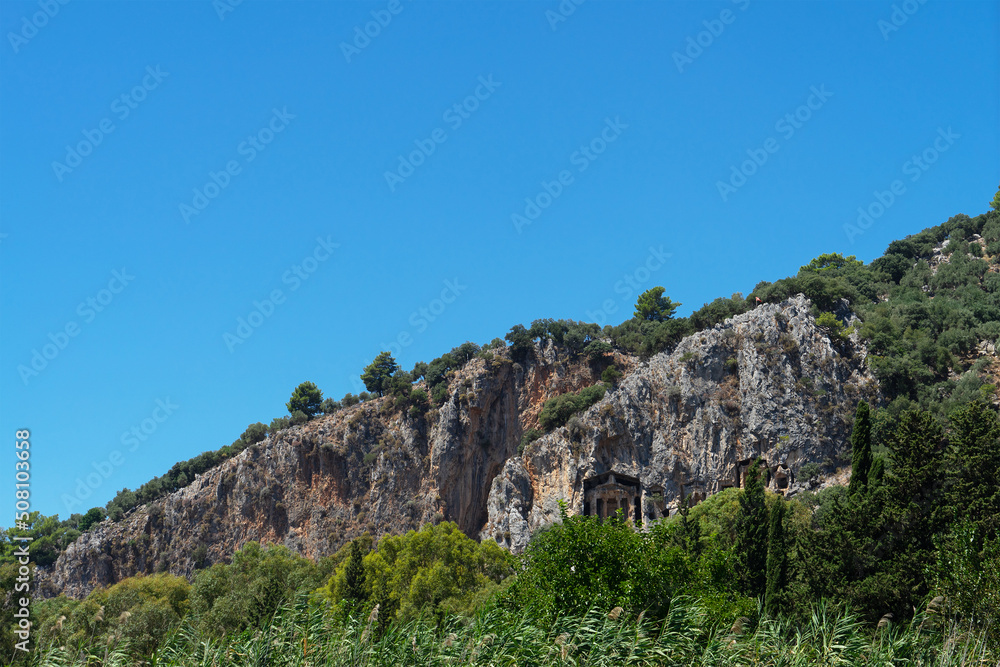 Lycian tombs near Dalyan across the Dalyan river in Mugla Province located between the districts of Marmaris and Fethiye on the south-west coast of Turkey