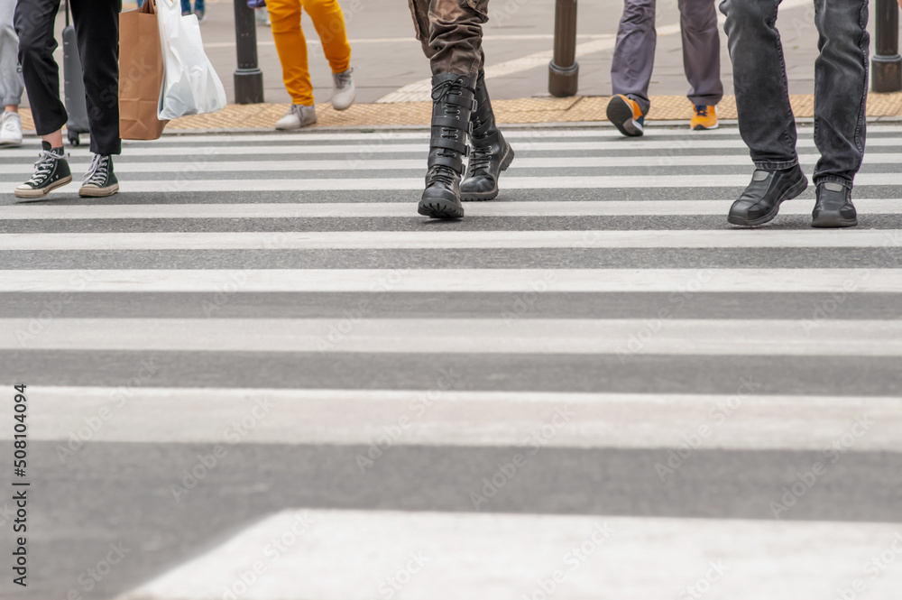 People crossing street in city, closeup view People crossing street in city, closeup view