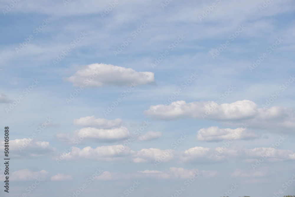 White cumulus clouds on blue sky White cumulus clouds on blue sky