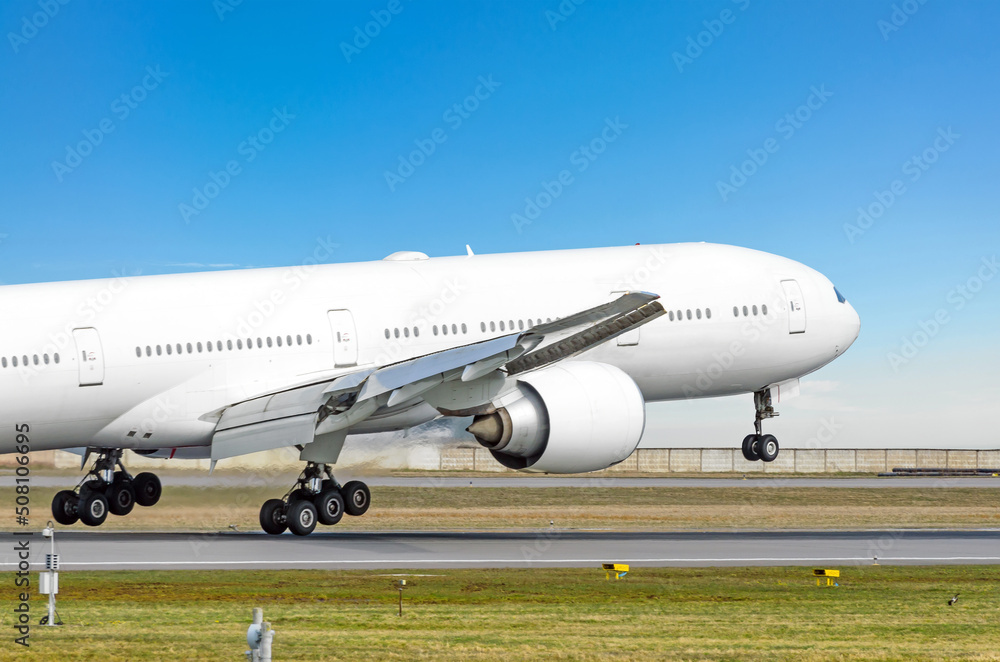 Airplane landing gear touching the runway, arrival Airplane landing gear touching the runway, arrival
