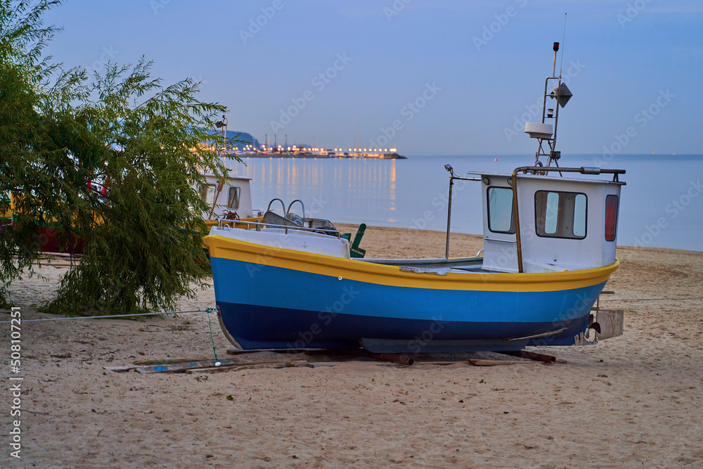 Picturesque fishing boat on beach in Sopot, Pomorskie region, Poland