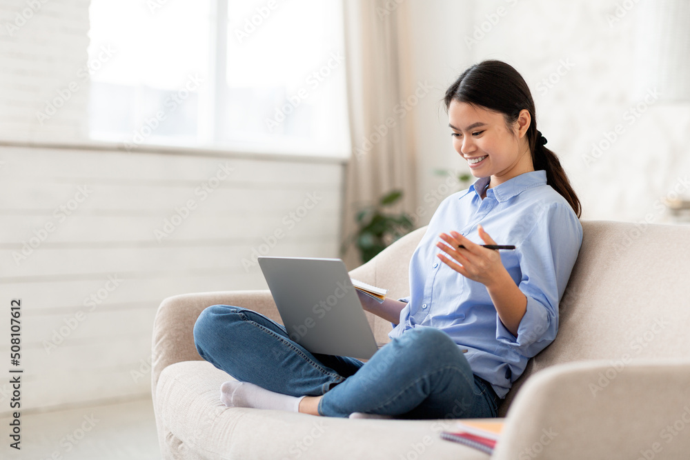 Chinese woman entrepreneur working from home, having video call Chinese woman entrepreneur working from home, having video call