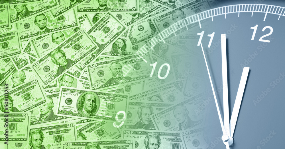 Clock on assorted American banknotes. Time is money idea Clock on assorted American banknotes. Time is money idea