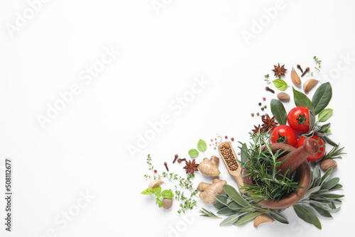 Fototapeta Naklejka Na Ścianę i Meble -  Different fresh herbs and spices on white background, top view