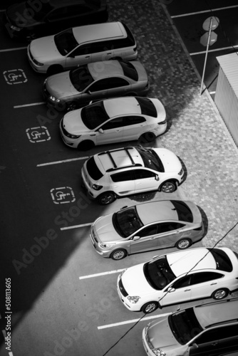 Black and white photo of a parking lot with cars © Богдан Тарасов