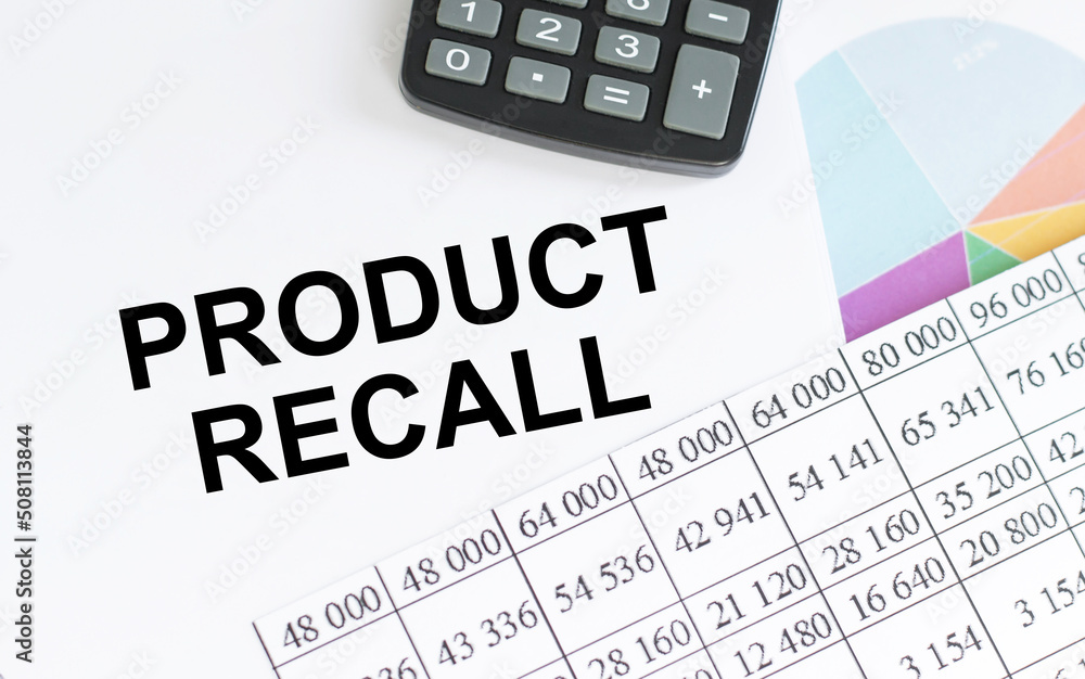 Text Product Recall on notepad on the table next to the Business Reports Calculator. Business concept Text Product Recall on notepad on the table next to the Business Reports Calculator. Business concept