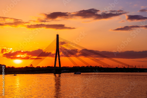 picturecque view from water surface to large river and cable - stayed bridge © Yaroslav