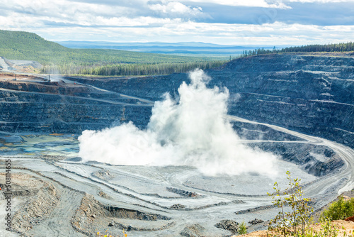 Explosion in the quarry. Mining of copper ore. Mining works. View from above.