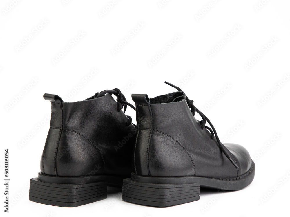 Men's autumn black leather jodhpur boots with laces and average heels, isolated white background. Back side view. Fashion shoes.
