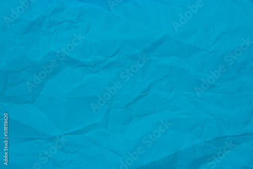 Crumpled blue paper craft textured background