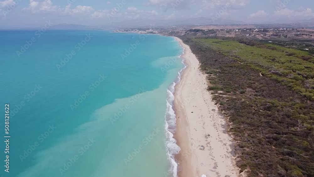Aerial drone view of the Natural Reserve Foce del Fiume Platani and Capo Bianco in Sicily with turquoise sea and white limestone cliffs on a sunny summer day. Province of Agrigento near Eraclea Minoa. Aerial drone view of the Natural Reserve Foce del Fiume Platani and Capo Bianco in Sicily with turquoise sea and white limestone cliffs on a sunny summer day. Province of Agrigento near Eraclea Minoa.