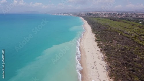 Aerial drone view of the Natural Reserve Foce del Fiume Platani and Capo Bianco in Sicily with turquoise sea and white limestone cliffs on a sunny summer day. Province of Agrigento near Eraclea Minoa. photo