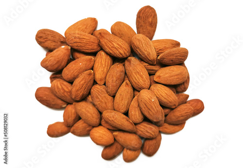 Golden almonds on the white background. Closeup of whole raw almonds