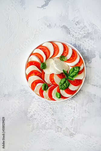 Traditional Italian Caprice salad tomato mozzarella cheese and basil