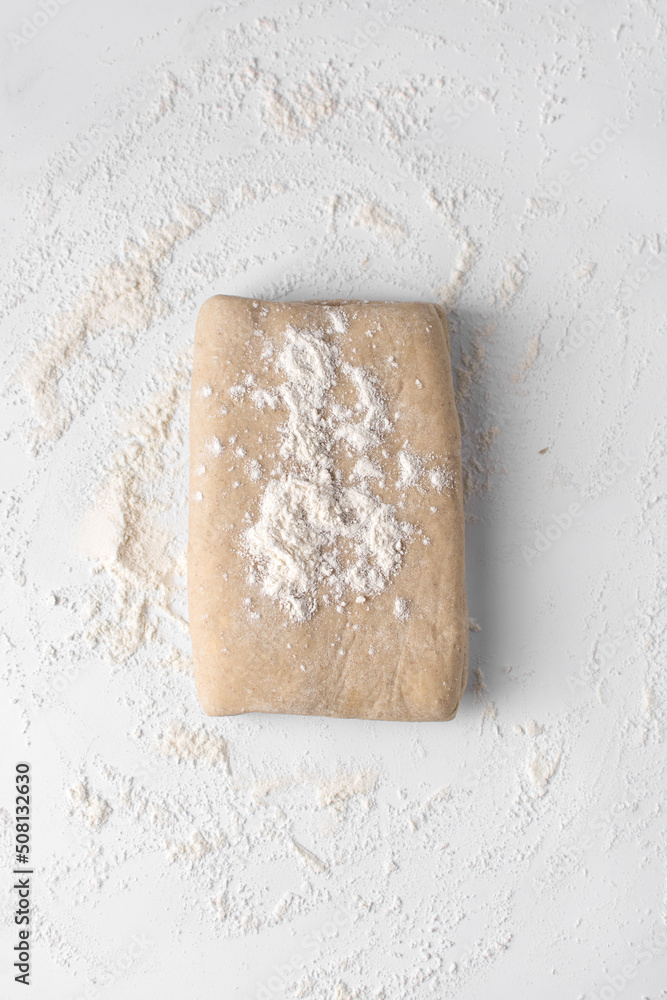 Pastry dough dusted with flour before rolling Pastry dough dusted with flour before rolling