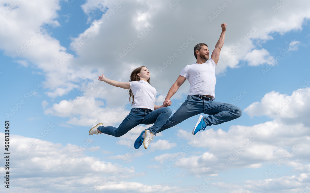 happy father and daughter jump in sky. family day happy father and daughter jump in sky. family day