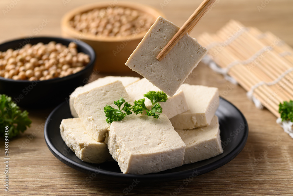 Homemade tofu with chopsticks, Vegan food ingredients in Asian cuisine, Plant based