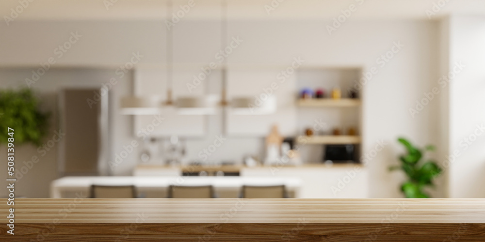 Wooden table top on blur kitchen room background,Modern Contemporary kitchen room interior. - obrazy, fototapety, plakaty 