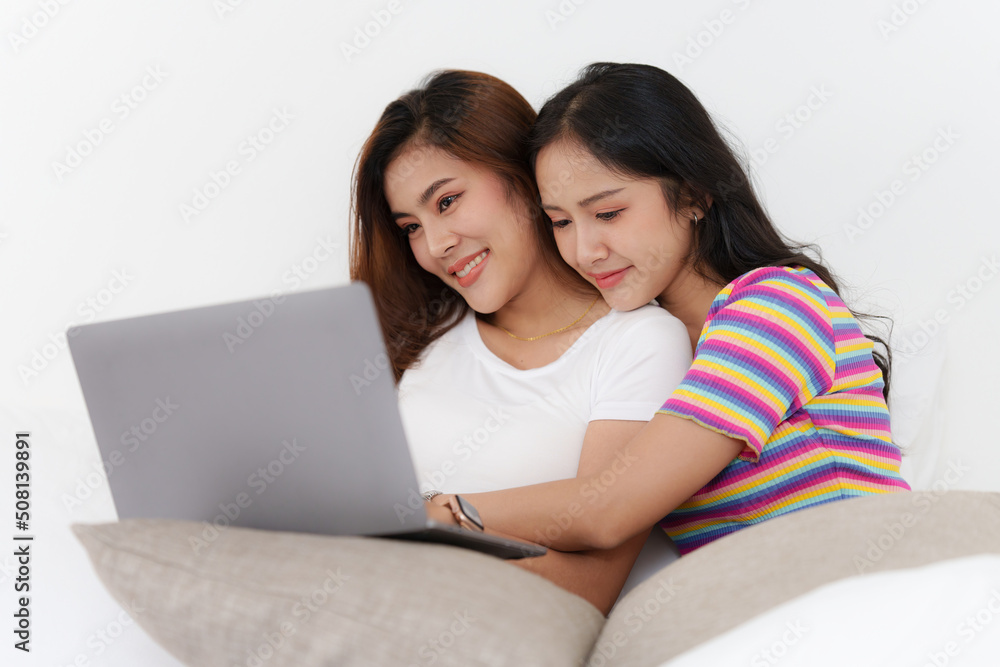 Young Asian Women LGBT lesbian couple love moments happiness at bedroom. LGBTQ or Gay and pride concpet. Young Asian Women LGBT lesbian couple love moments happiness at bedroom. LGBTQ or Gay and pride concpet.