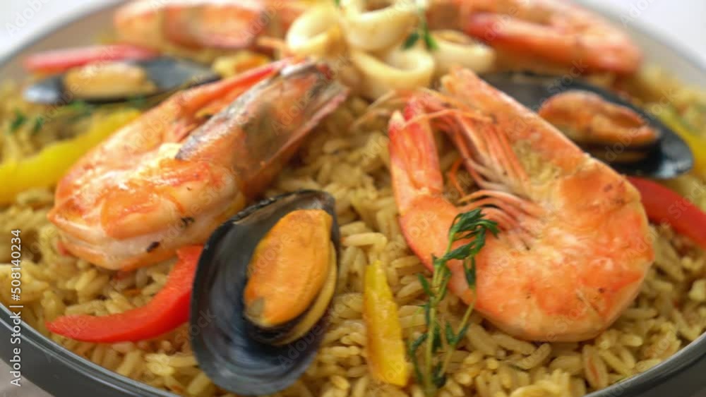 Seafood Paella with prawns, clams, mussels on saffron rice - Spanish food style Seafood Paella with prawns, clams, mussels on saffron rice - Spanish food style