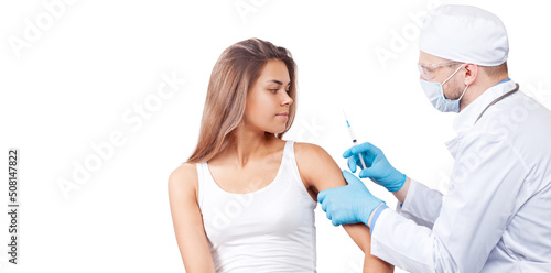 Doctor gives a syringe with vaccine to patient at clinic.