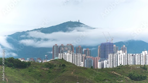 Mountain Tai Mo Shan and skyline of Yuen Long district in Hong Kong city