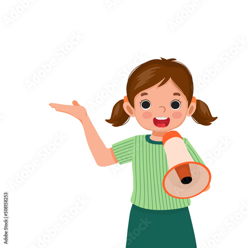 happy little girl holding megaphone speaking and shouting making announcement with hand showing for copy space