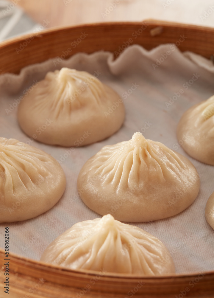 Xiaolong soup dumplings in a steamer Xiaolong soup dumplings in a steamer