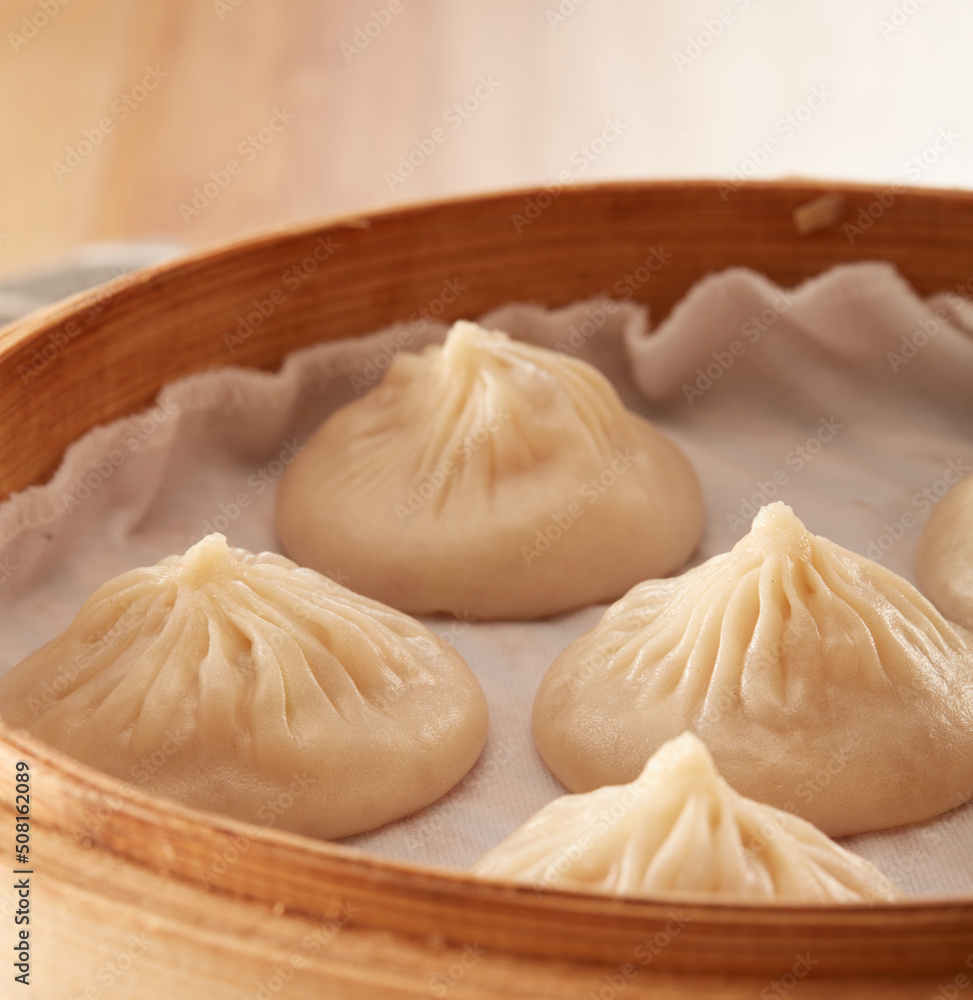 Xiaolong soup dumplings in a steamer Xiaolong soup dumplings in a steamer