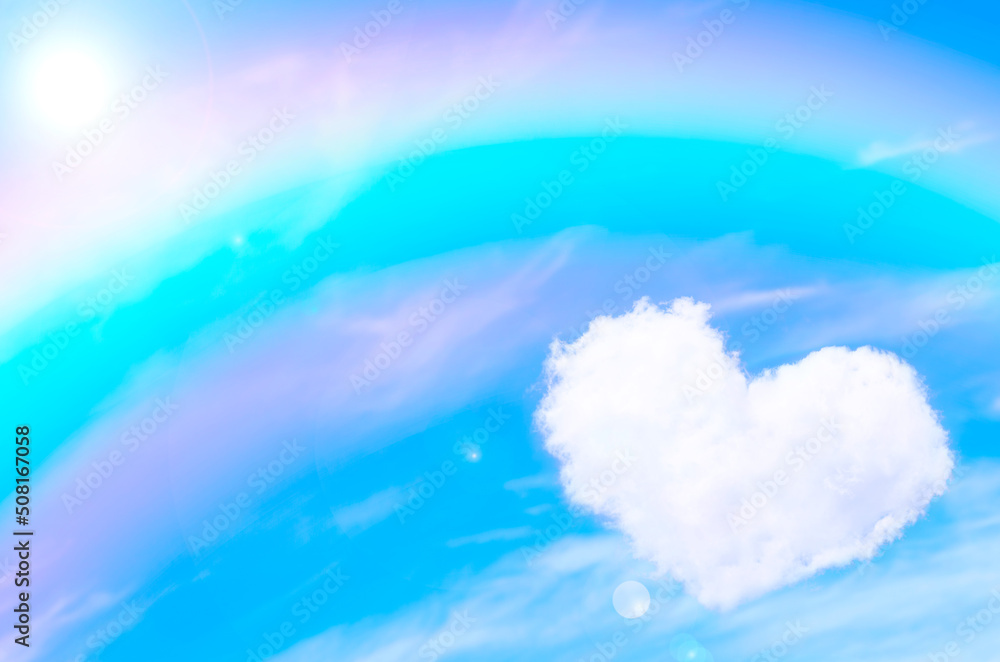 ハートの雲と虹の空の背景素材