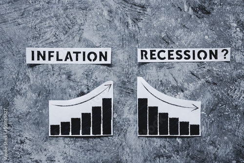 Fotografie inflation and recession texts and graphs showing prices going up and growth goin