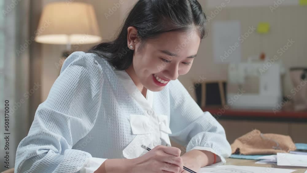 Close Up Of Asian Woman Designer Is Drawing On The Layout Bond At The Office
Close Up Of Asian Woman Designer Is Drawing On The Layout Bond At The Office