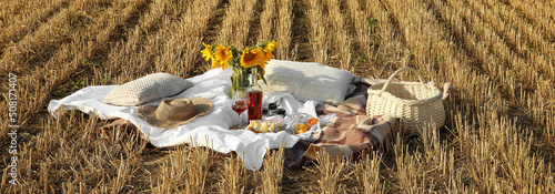 Plaid and wicker basket wit...