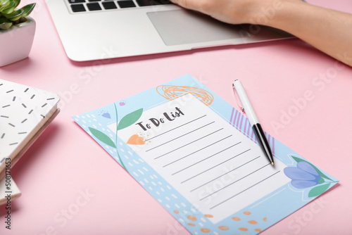 To-do list and pen on color...