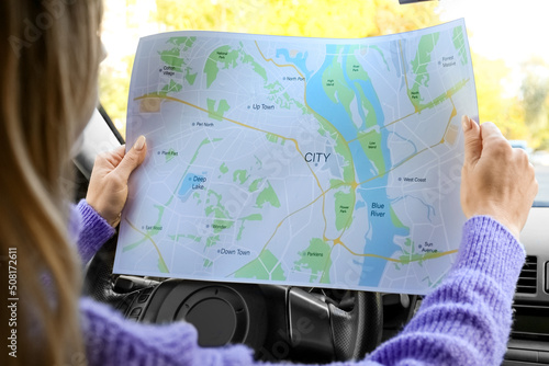 Female driver with city map...