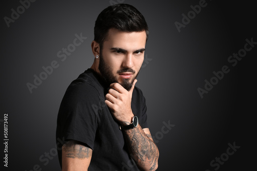 Fashionable man touching be...