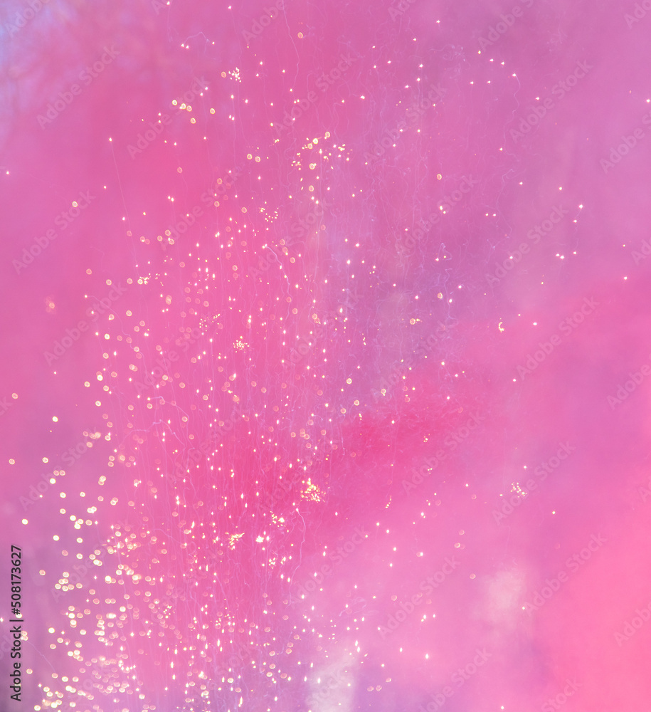 Red smoke with firework sparks in nature during Red smoke with firework sparks in nature during