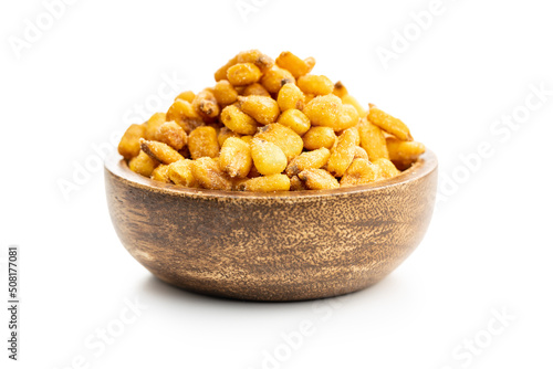 Roasted salted corn snack in bowl isolated on white background. photo