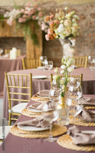 festive wedding table with glasses, napkins and plates