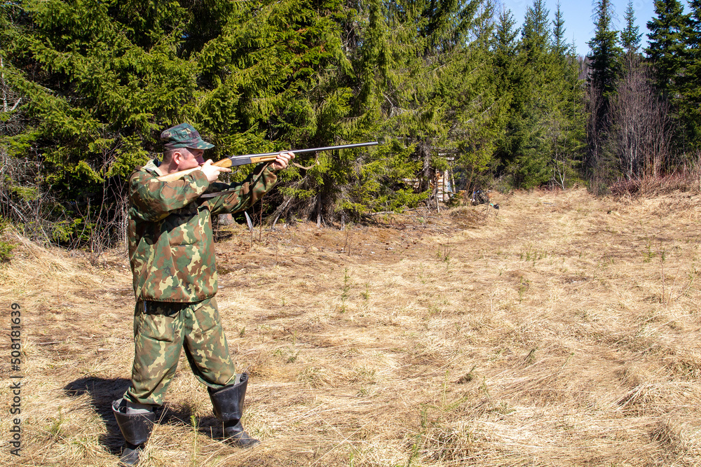 The hunter is aiming at the gun The hunter is aiming at the gun