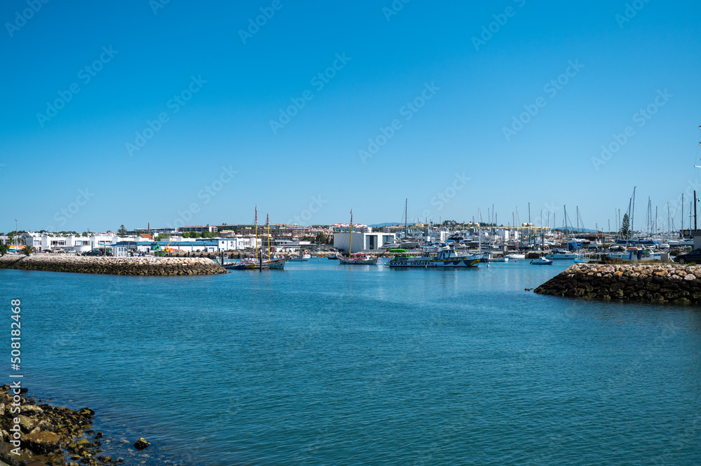 Panorama of the promenade of the tourist city of Lagos in the Algarve, Portugal in the summer of 2022.