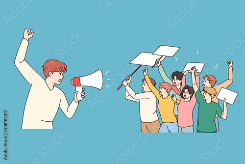 Male leader with megaphone head demonstration with diverse people holding banners and posters. Activists on strike or riot protest against discrimination, vote for freedom. Vector illustration. 
