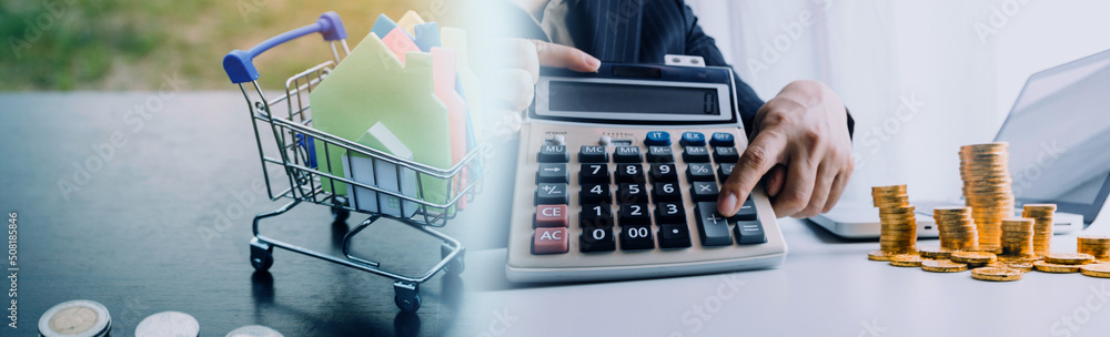 businessman working on desk office with using a calculator to calculate the numbers, finance accounting concept businessman working on desk office with using a calculator to calculate the numbers, finance accounting concept