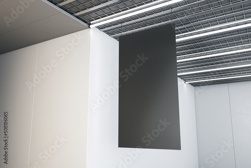 Close up of blank black stopper hanging in concrete interior with industrial ceiling. Mock up, 3D Rendering.