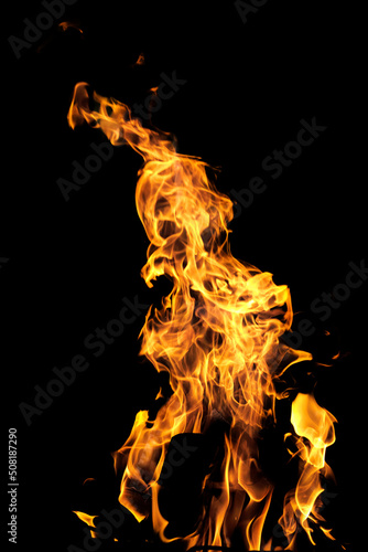 Flames or fire isolated on a black background. Burning gasoline of bright red color © Andrey